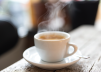 A cup of coffee on a saucer</p>
<p>Description automatically generated